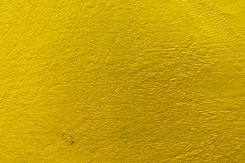 a large yellow piece of paint that looks like it is very bright and yellow