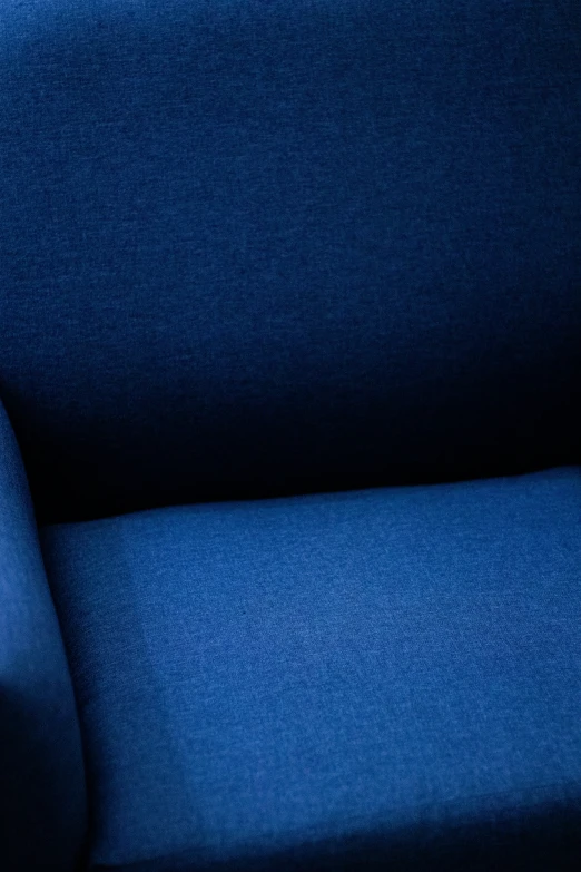 the bottom half of a dark blue chair