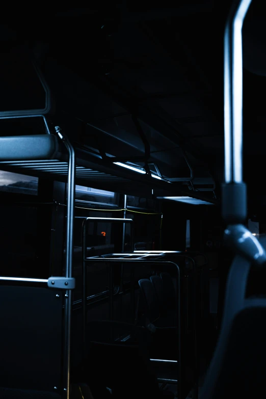 a dark bus with one seat is empty