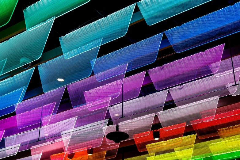 multicolored abstract po of a building with large, triangular shapes