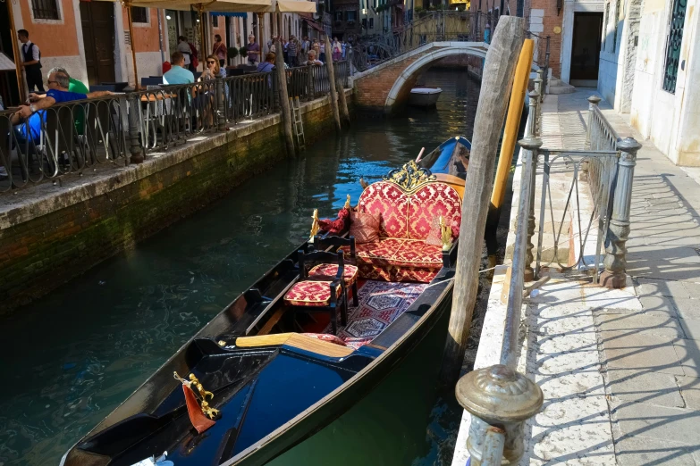 the back end of a boat that is floating down water