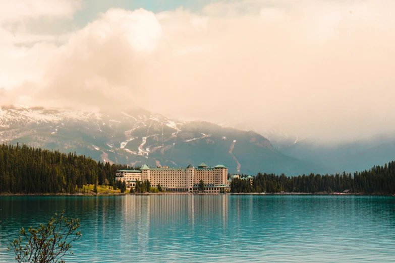 the mountains are reflected in the lake with the el