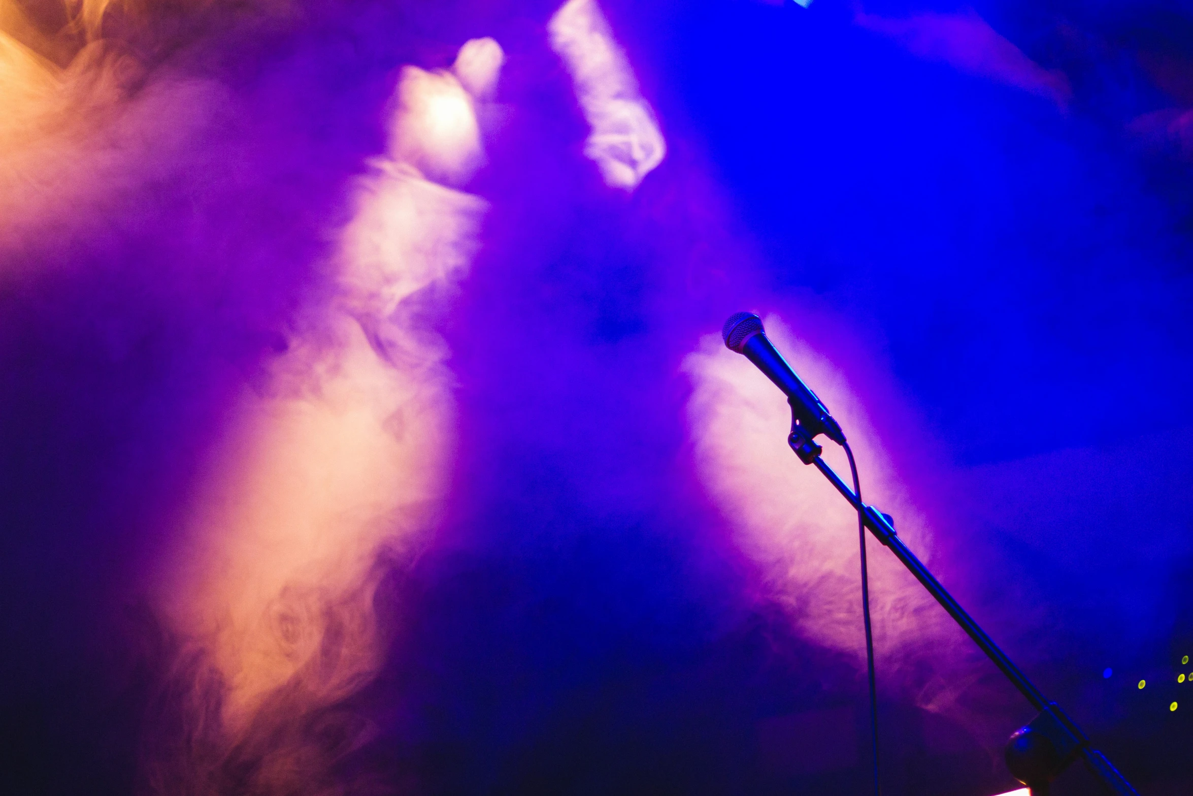 a microphone that is on the side of a stage