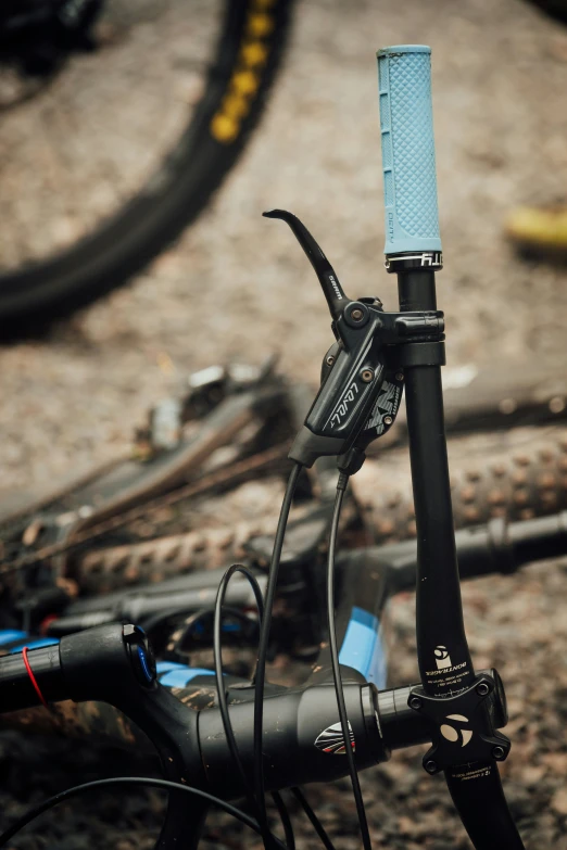 a closeup s of the handlebar and cable on a bicycle