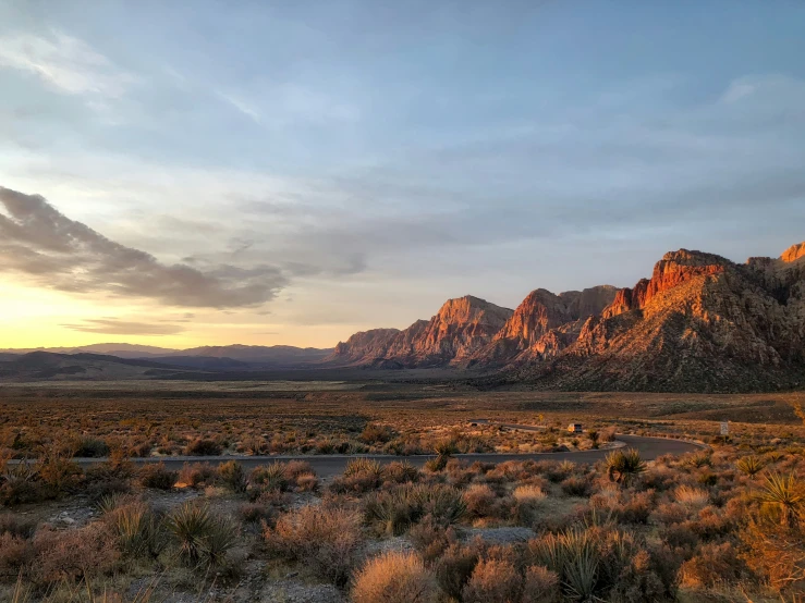 mountains on either side of a road in an arid area