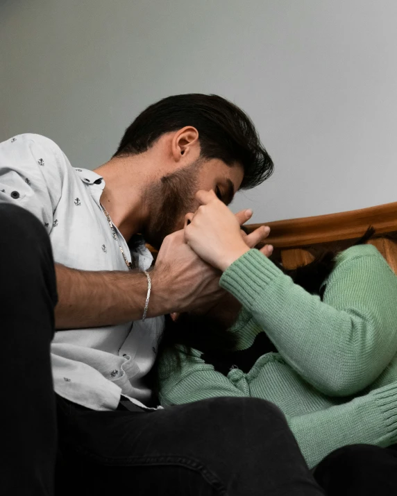 a man and woman hold their hands during a vigilion