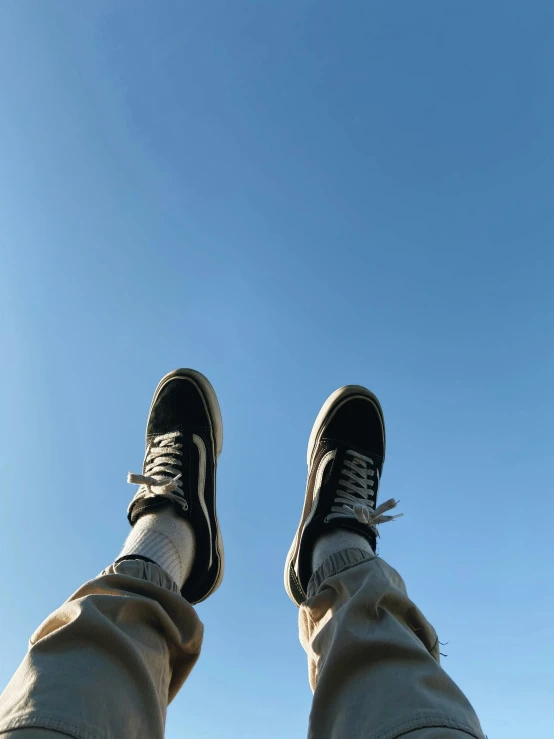 shoes standing at the bottom of a blue sky