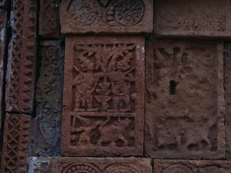 a carved stone carving on the side of a building