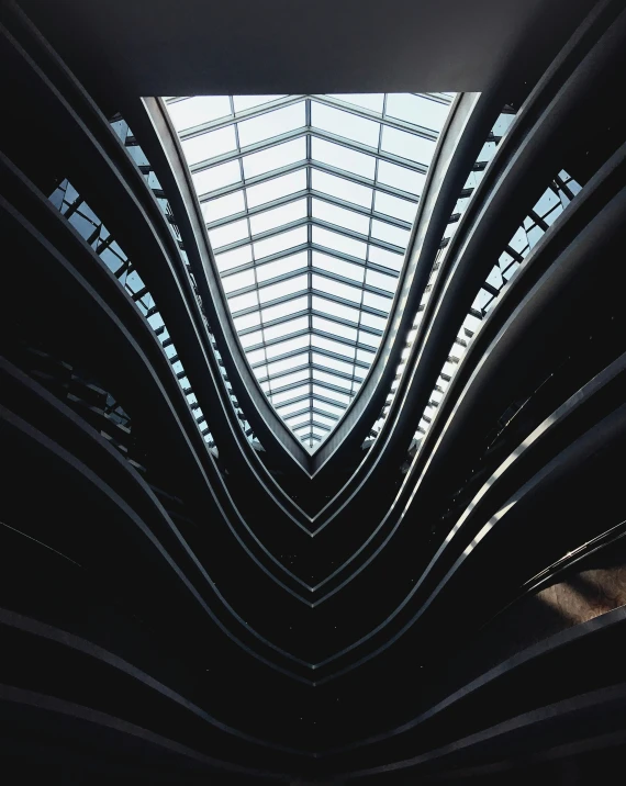 a long row of modern building that is under a roof