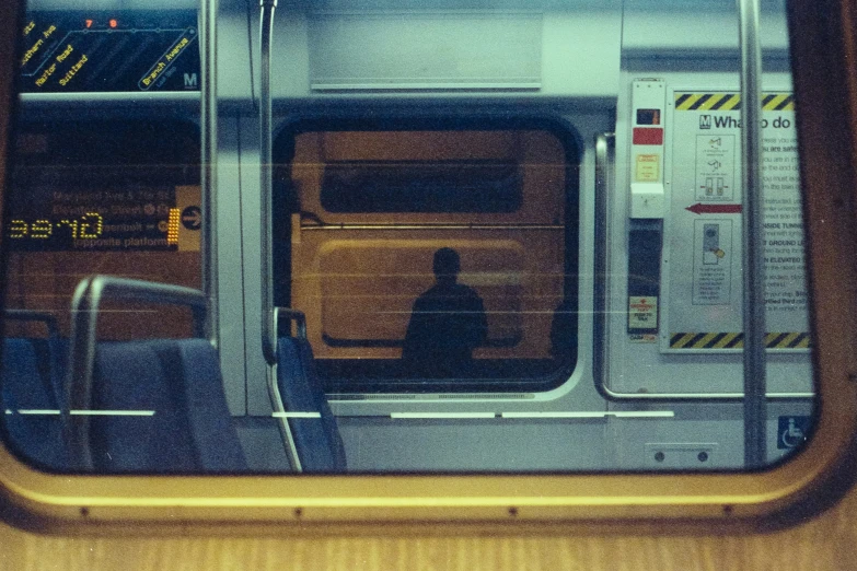 a view from inside a train window, through the doors