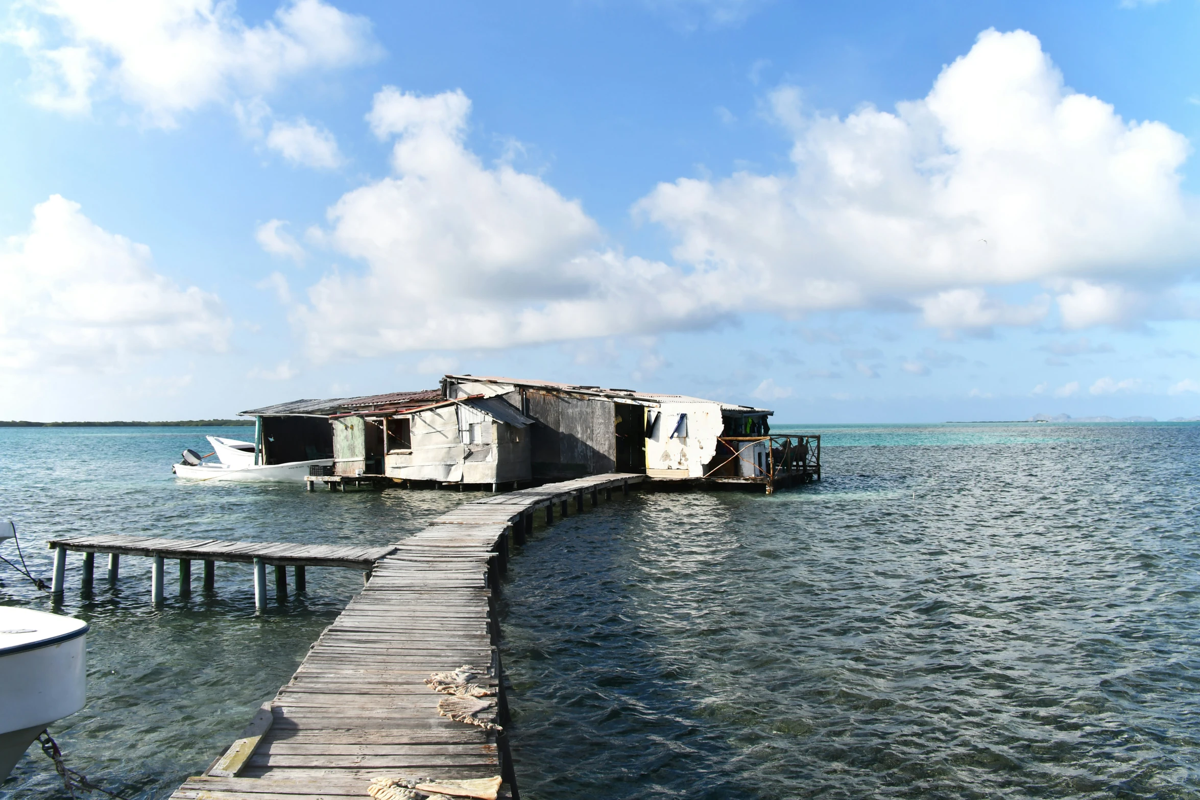 a dock with two boats sitting out on it