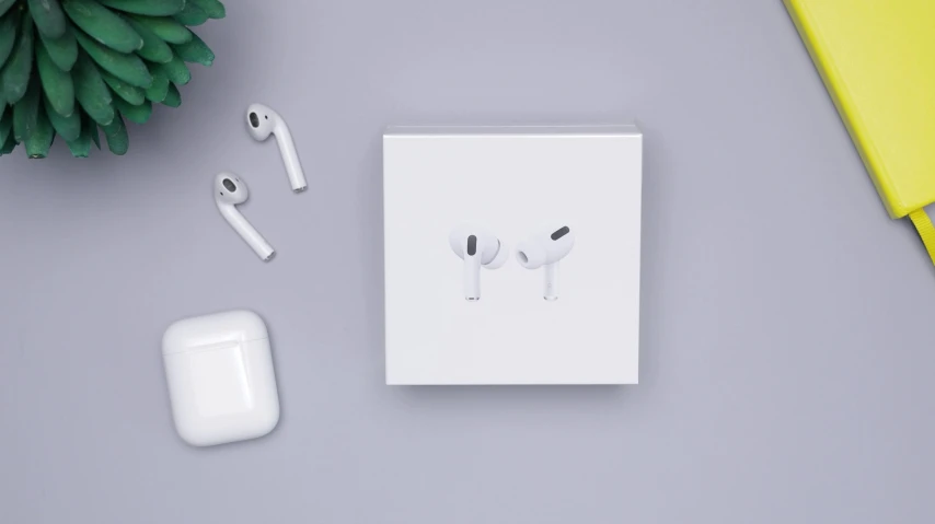 a wireless earphone, power bank, and other accessories on a table