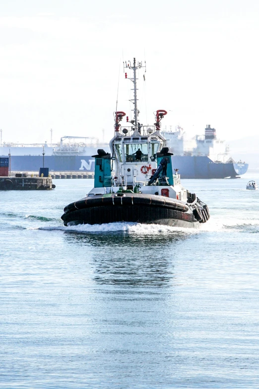 a tug boat traveling through the water