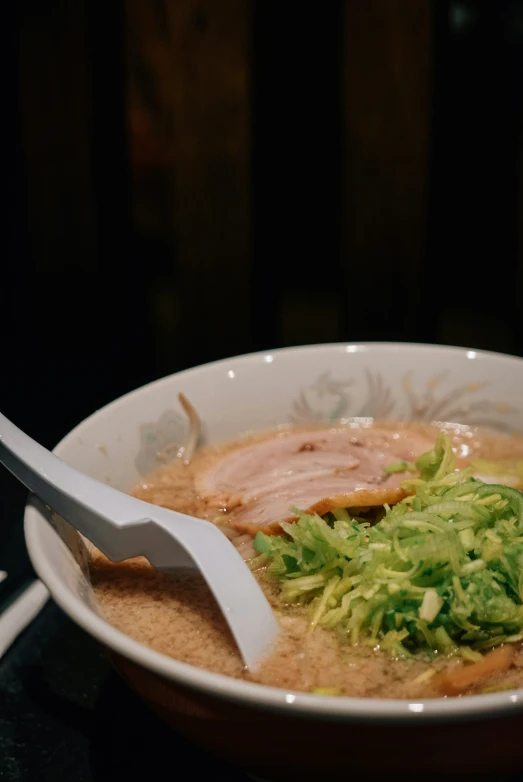 soup with lettuce and other ingredients in a bowl