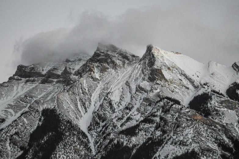 mountains covered in snow are seen from the sky