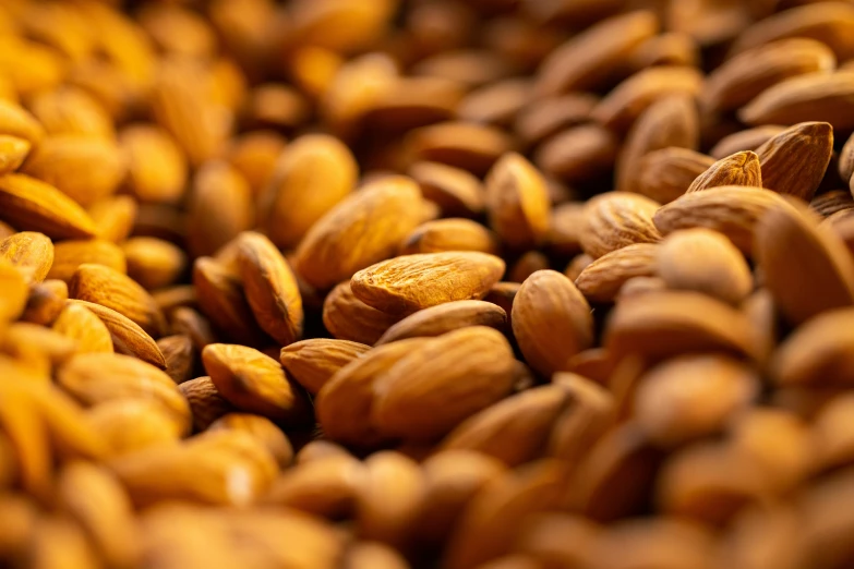 almonds have been gathered together in the center of the image