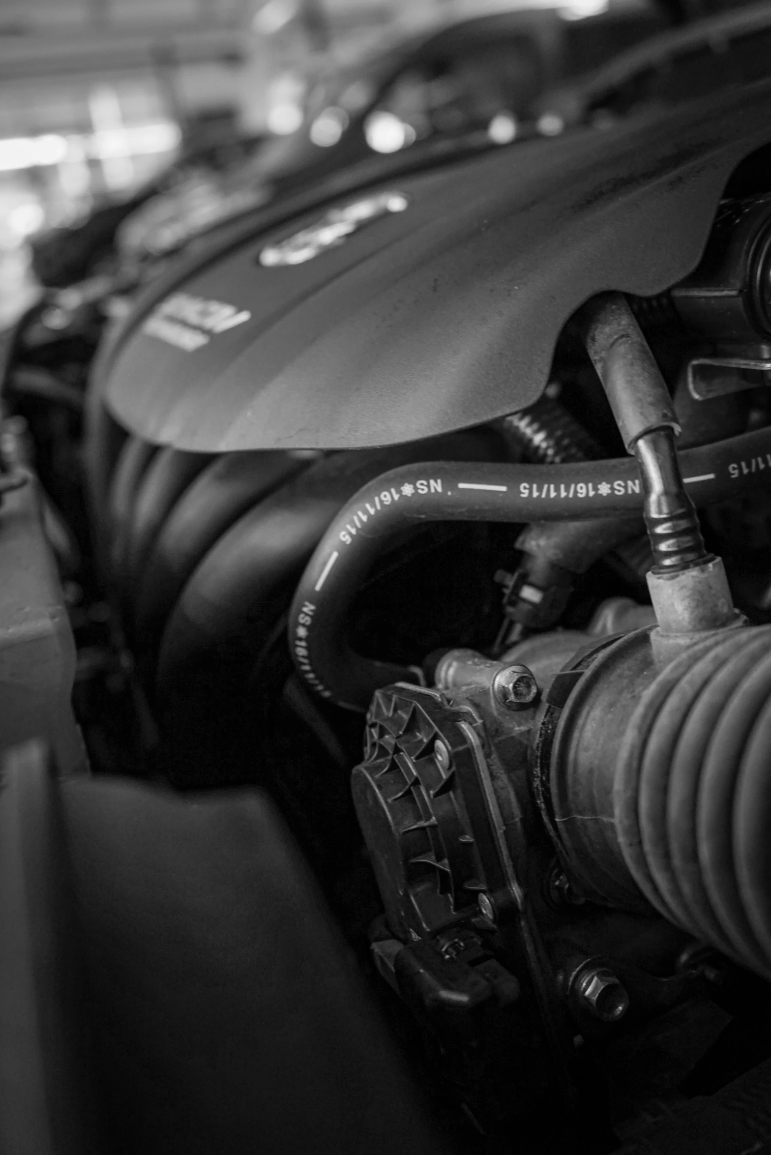 an engine sits parked next to a car