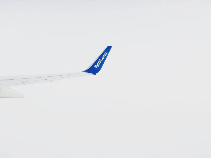 the side of an airliner flying in the sky