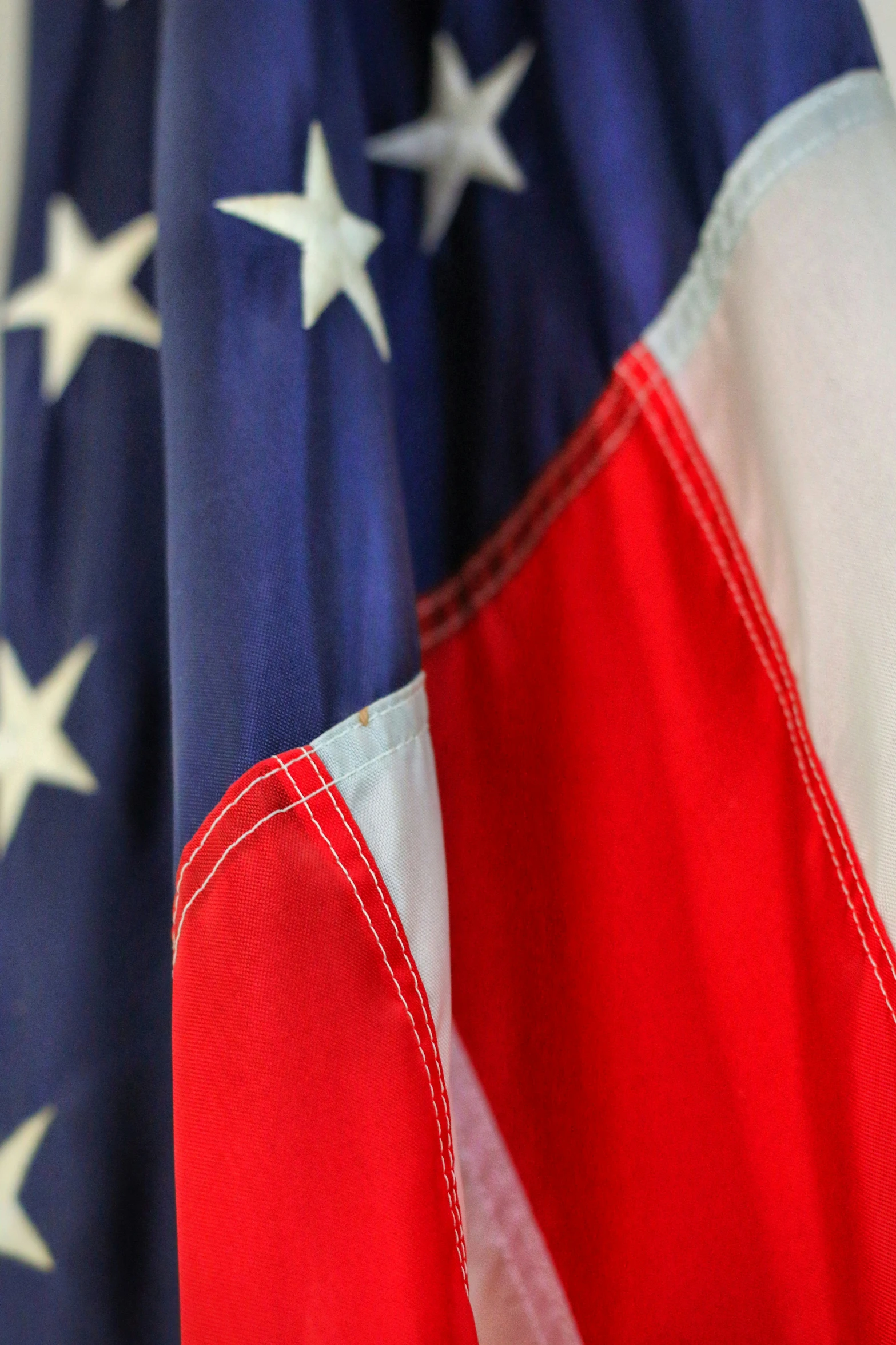 a closeup of an american flag with some white stars