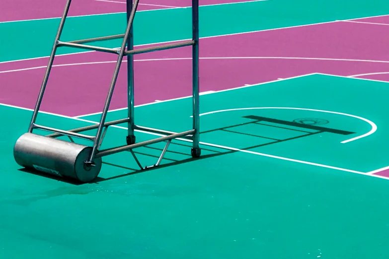 a blue and purple tennis court with a ladder to put on it