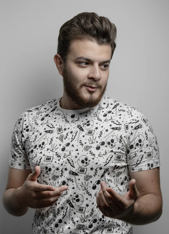 a man making his hand gestures while posing for the camera