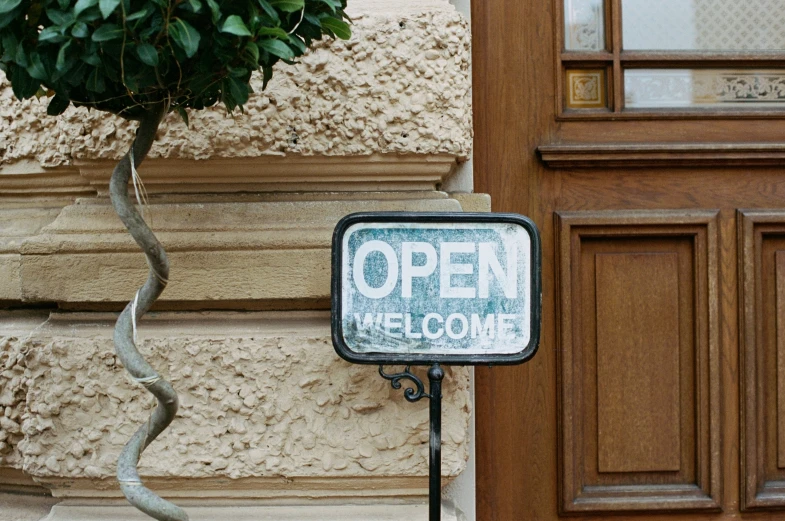 a sign that is sitting in front of a door