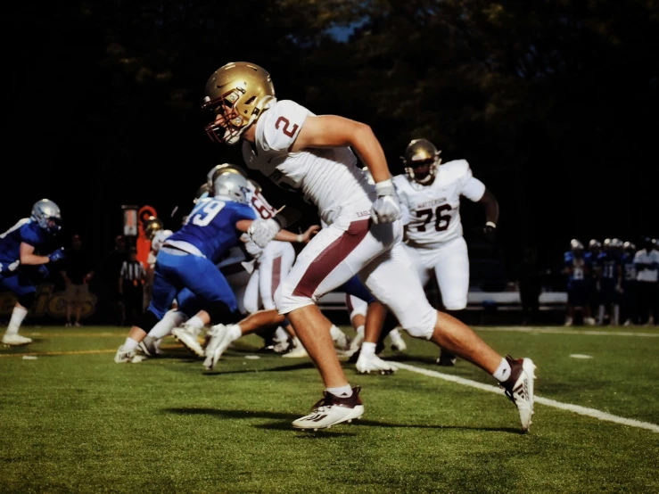 the football players are running down the field together