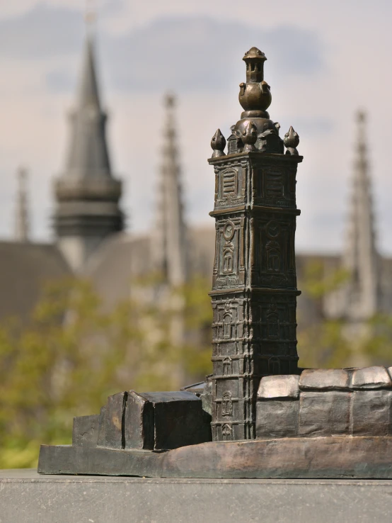 a close up of the top of a statue of a clock tower