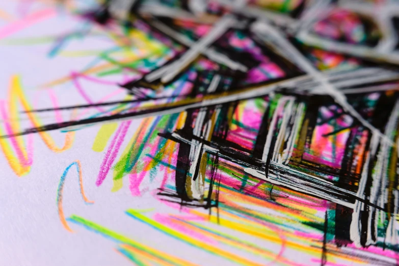 colored lines are visible above a drawing with black crayons