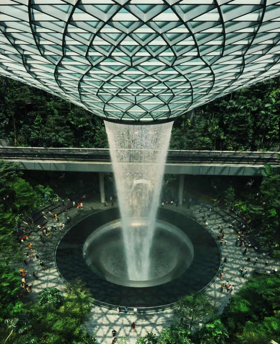 the view of the interior from below is of the fountain in the sky garden