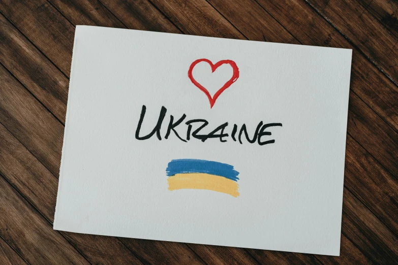 paper with the words ukraine and a heart