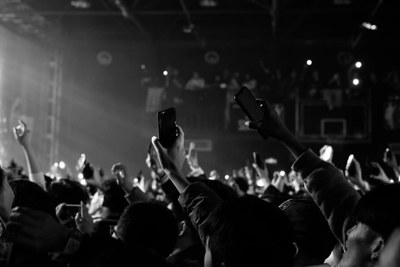 a black and white po of a concert in a crowd