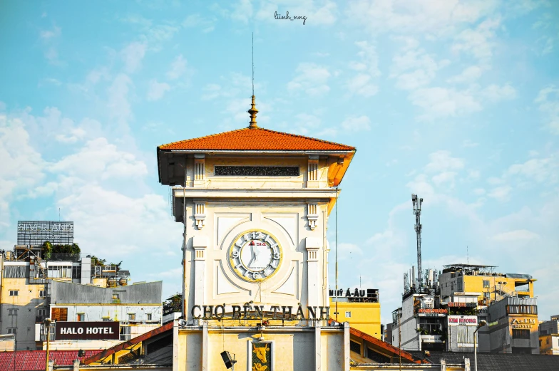 a very tall white clock tower sitting under a blue sky