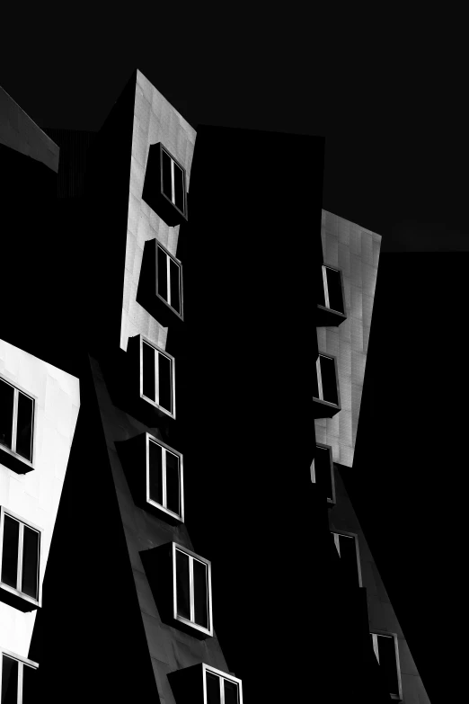 a black and white pograph of an apartment building
