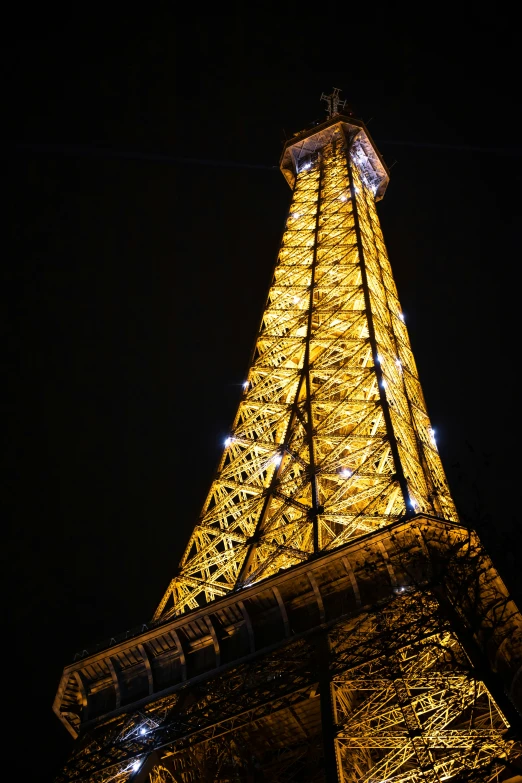 the eiffel tower is very tall and beautiful at night