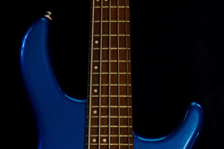 a guitar with a blue body and a fret pickup