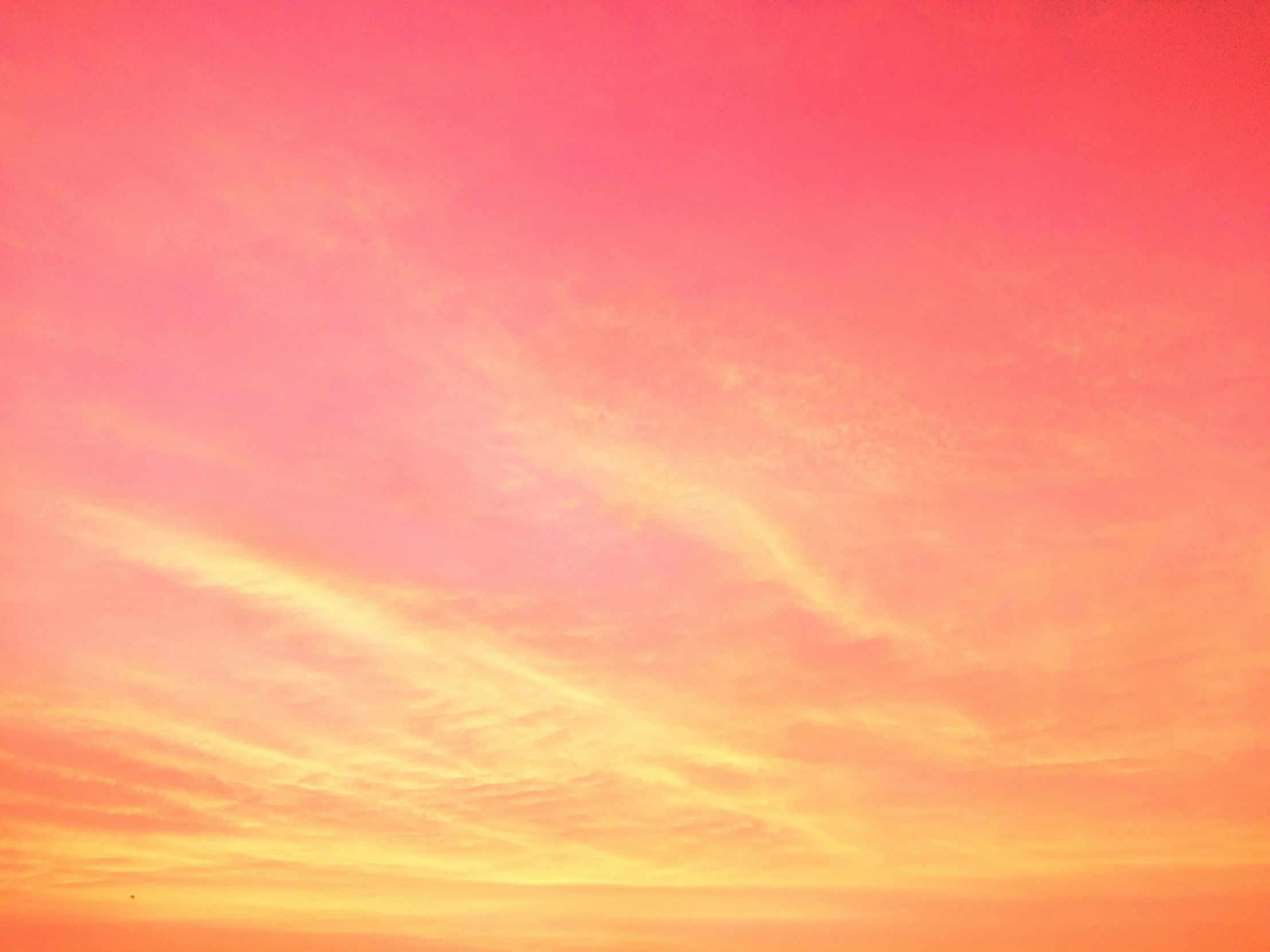 the sun is rising over a beach on a clear day