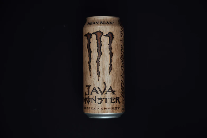 a can of monster energy drinks with a black background