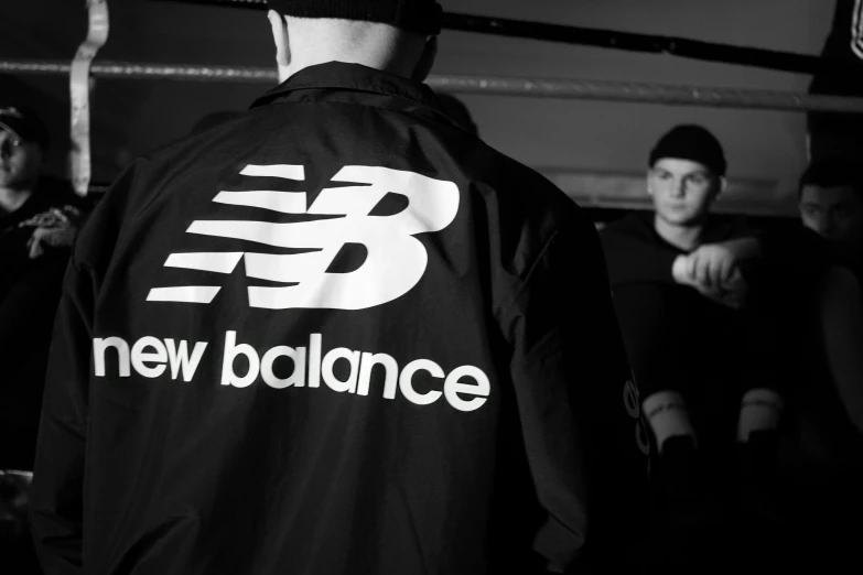 the new balance jacket on a man's shoulder