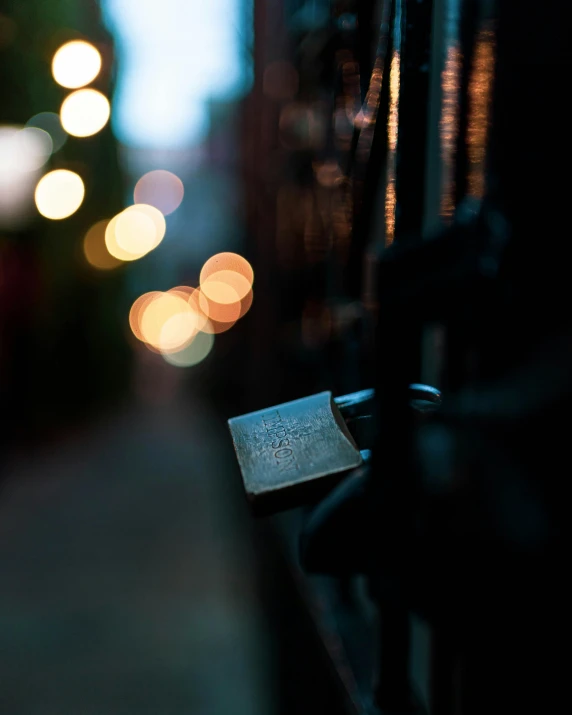 the back end of a bicycle with some lights on the street