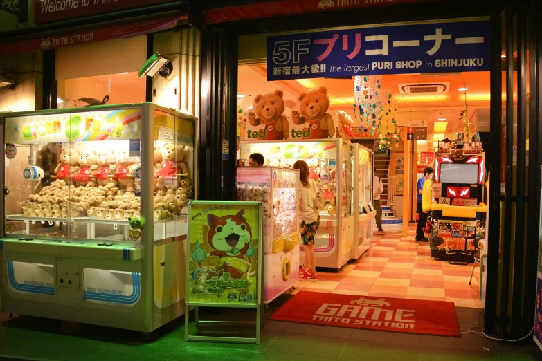 two electronic machines are displayed inside a store