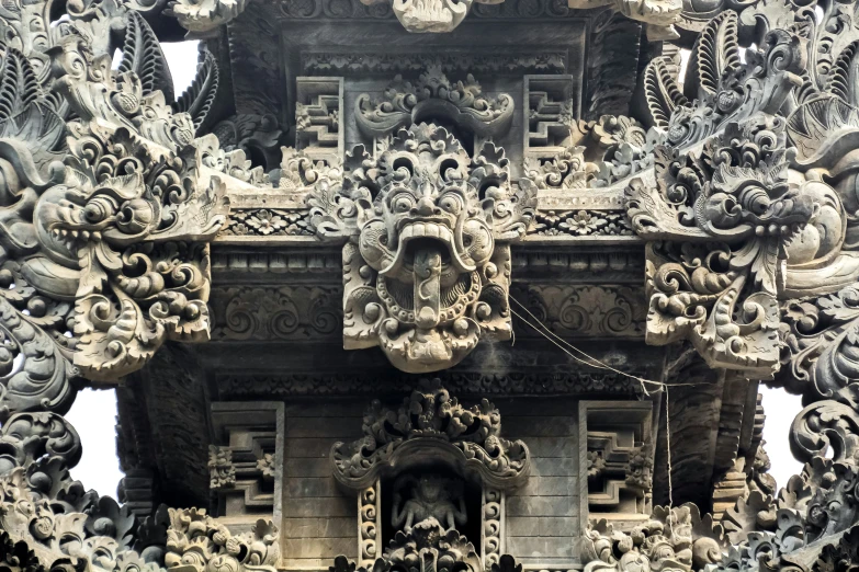 some carving is attached to the side of an ornate building