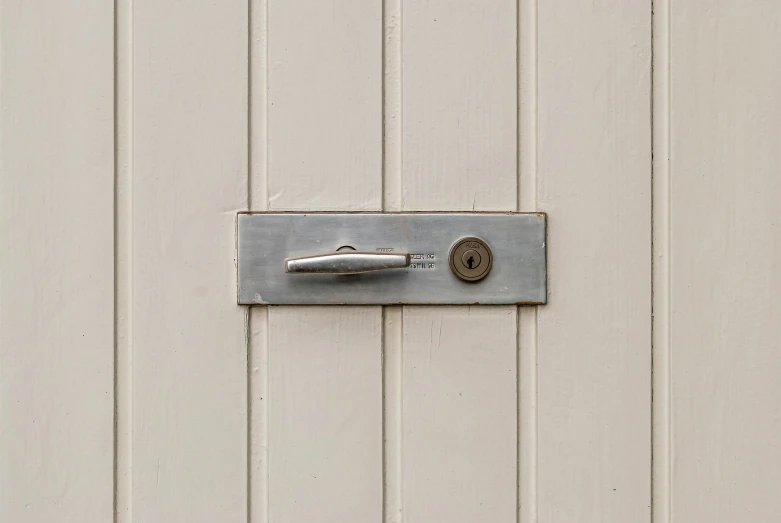 the handle on a door is attached to a metal square