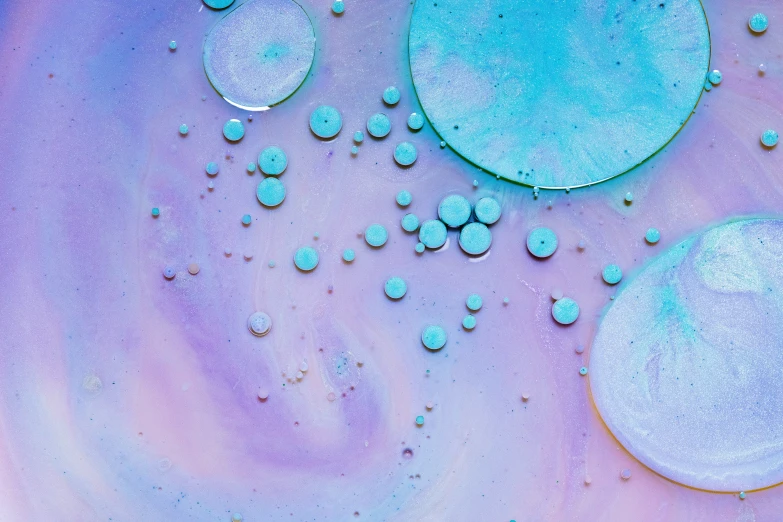 an abstract painting of small bubbles in water