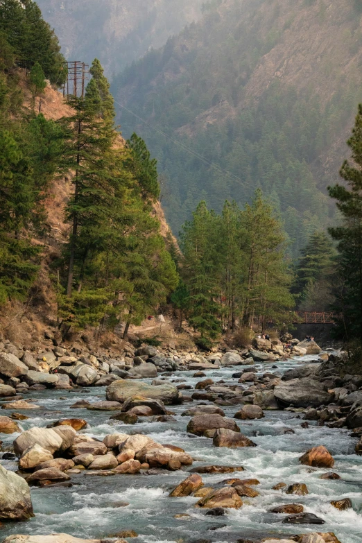 a river flows through a rocky valley