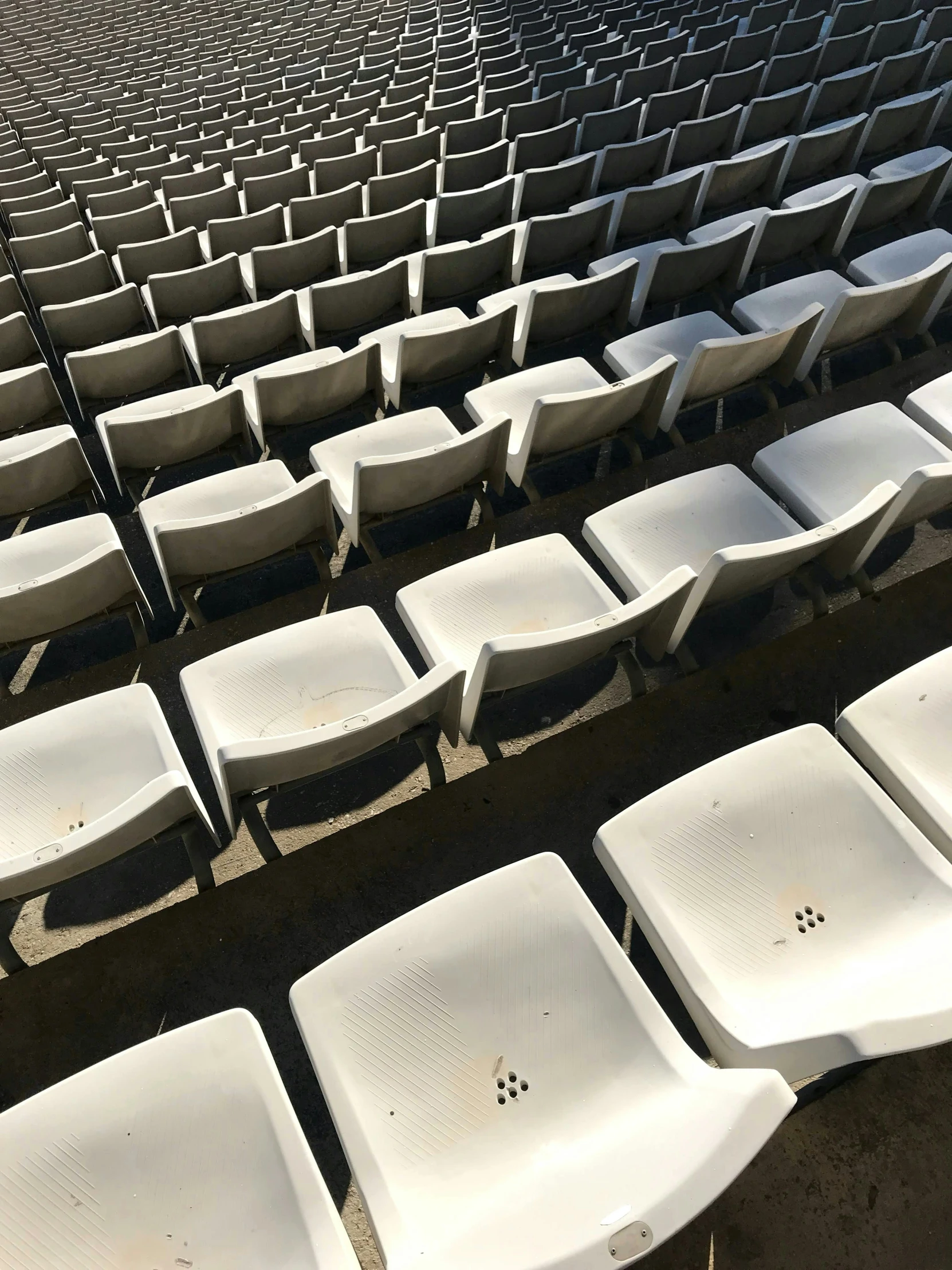 several chairs and seats sitting in an empty room