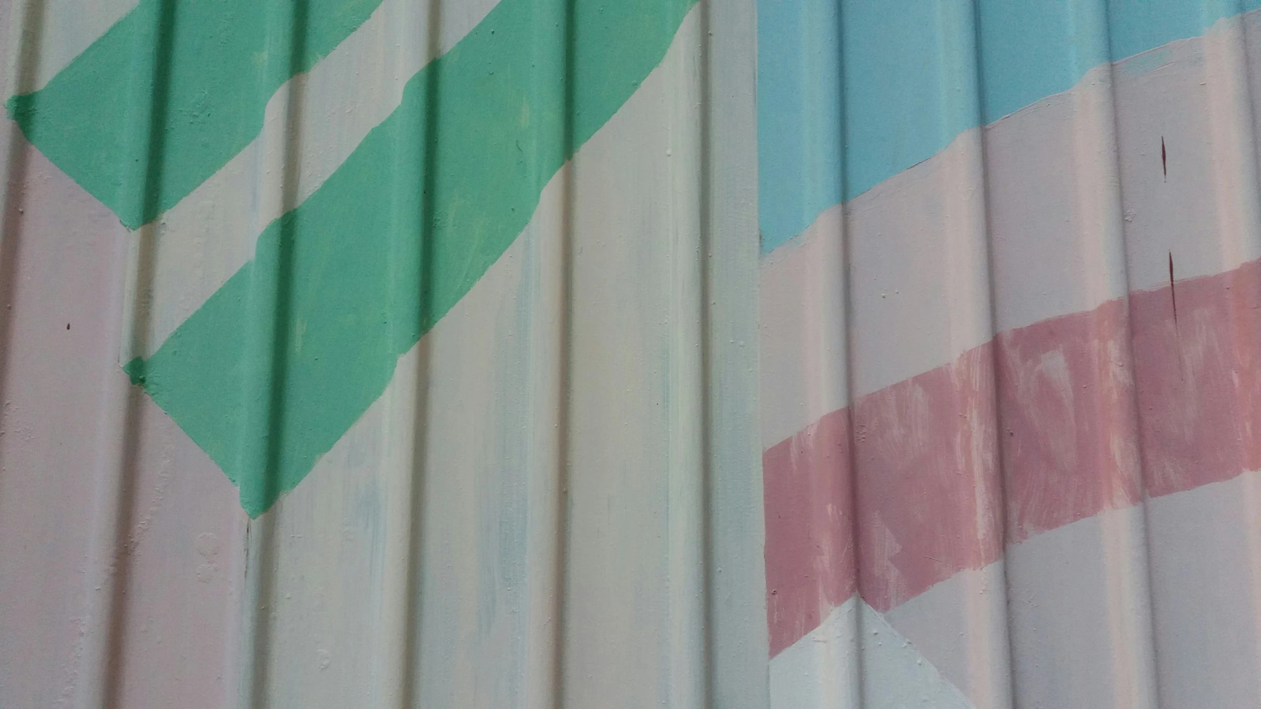 the side of an iron building with red, white and blue stripes