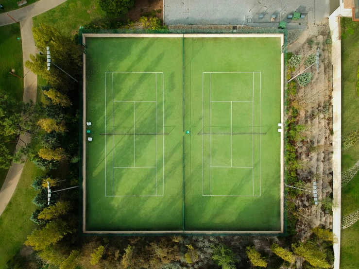 a tennis court with two empty tennis courts