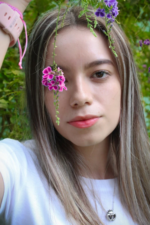 a  with flowers all over her face