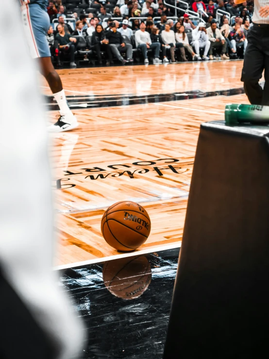 a basketball sitting on top of a wooden floor